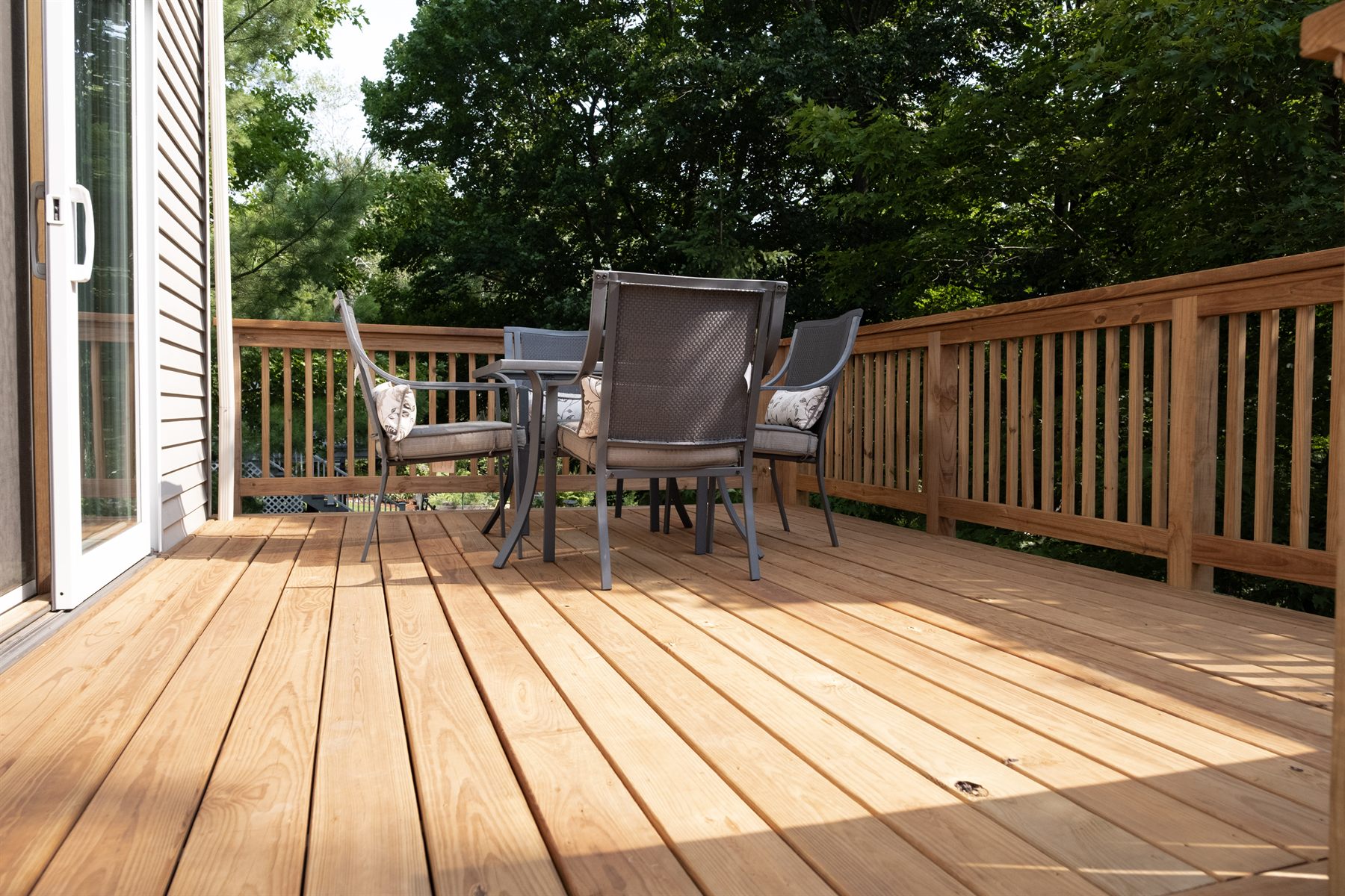Modest Home Deck with Metal Railings